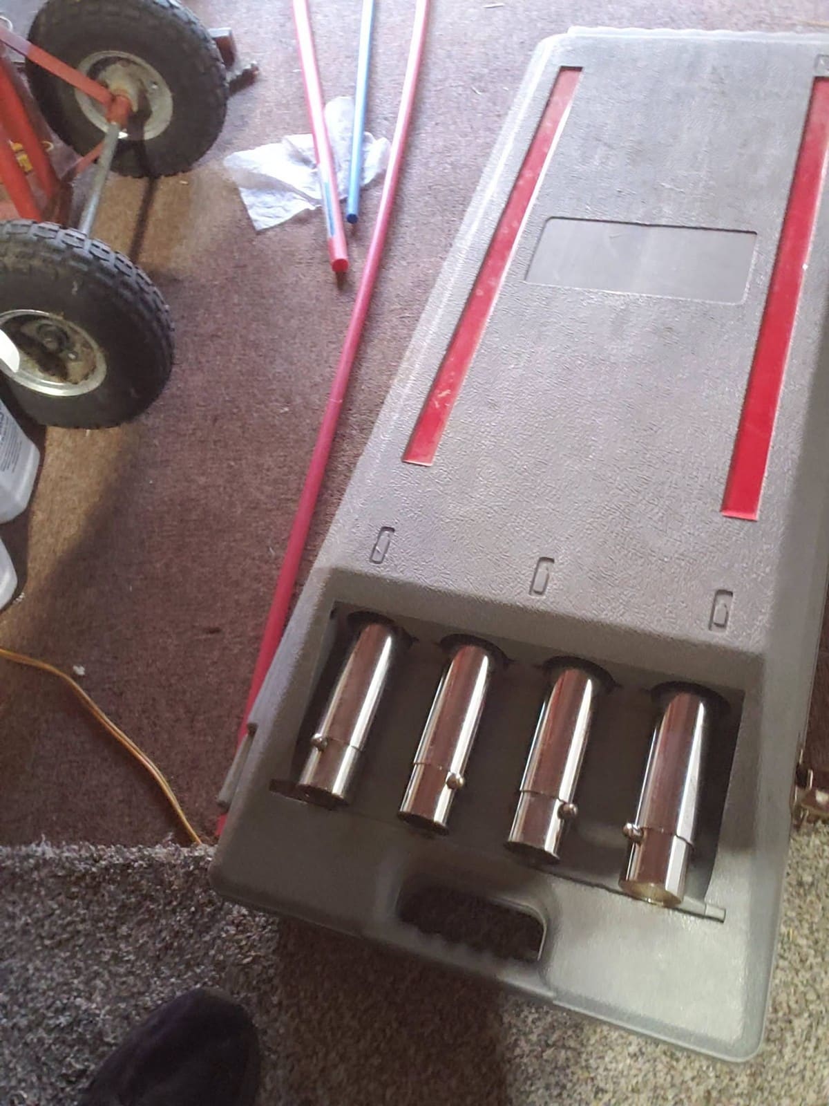 Battery charger with four ammunition rounds displayed in charging slots